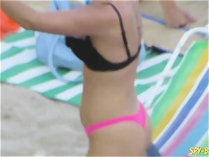 pinkish swimsuit fledgling sans bra voyeur Beach dolls