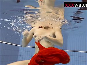 fabulous hot woman swimming in the pool